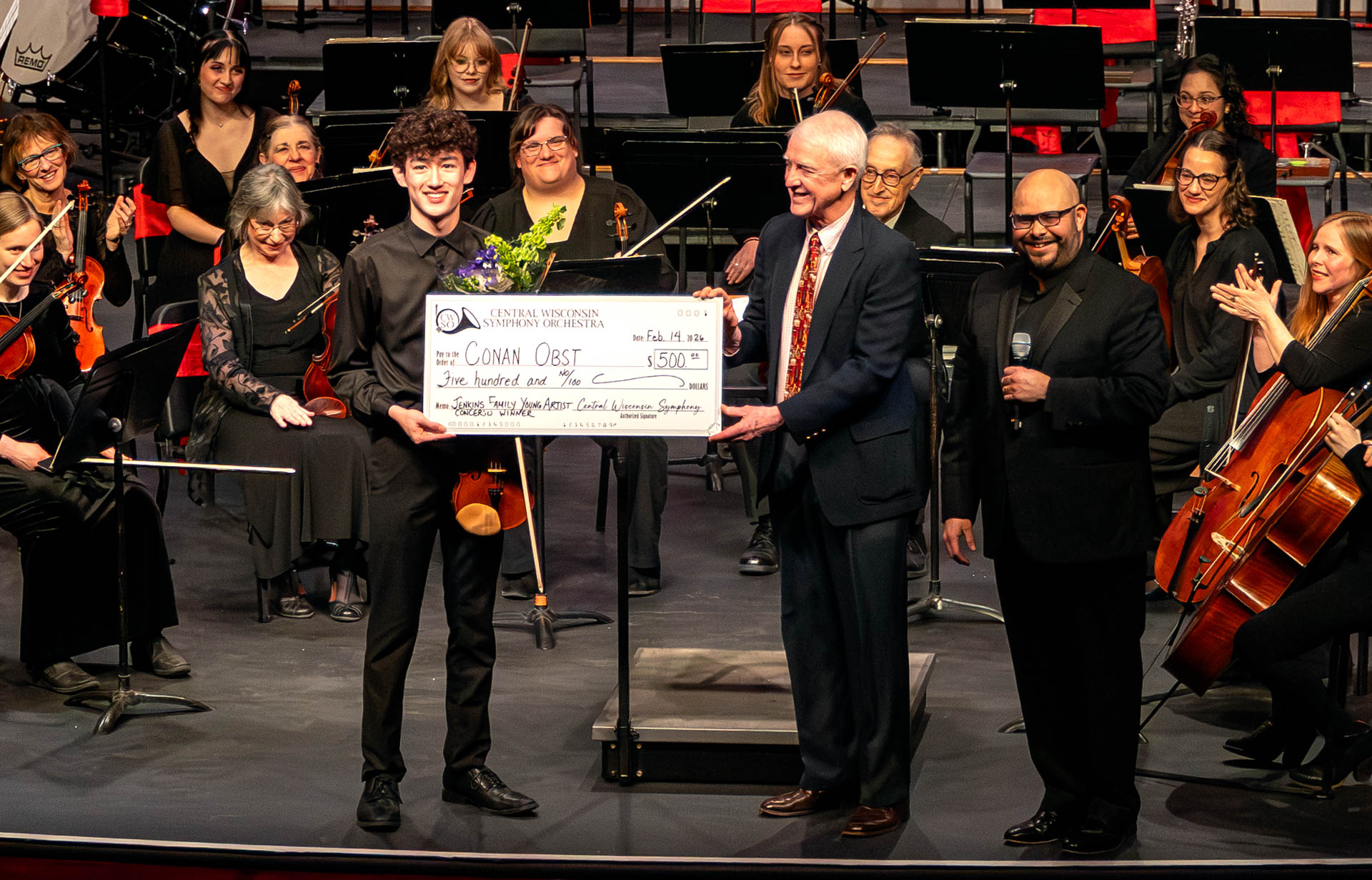 Megan Yang being presented her prize check in February 2025.